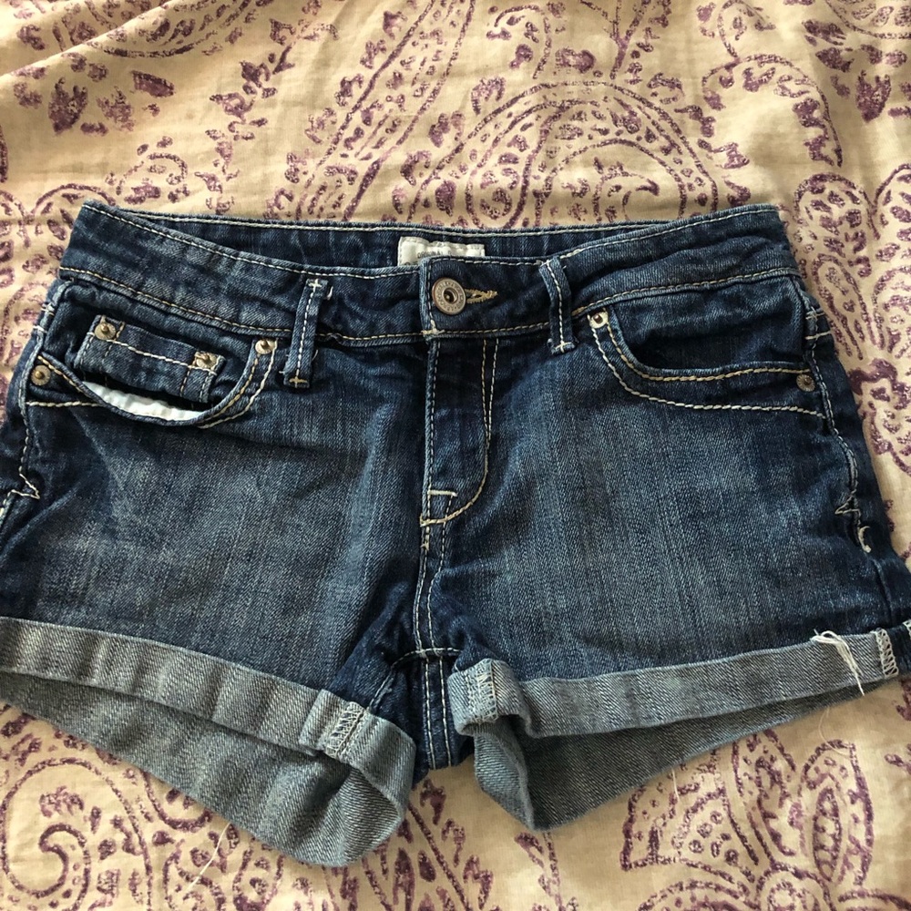 Blue dark wash jean shorts.